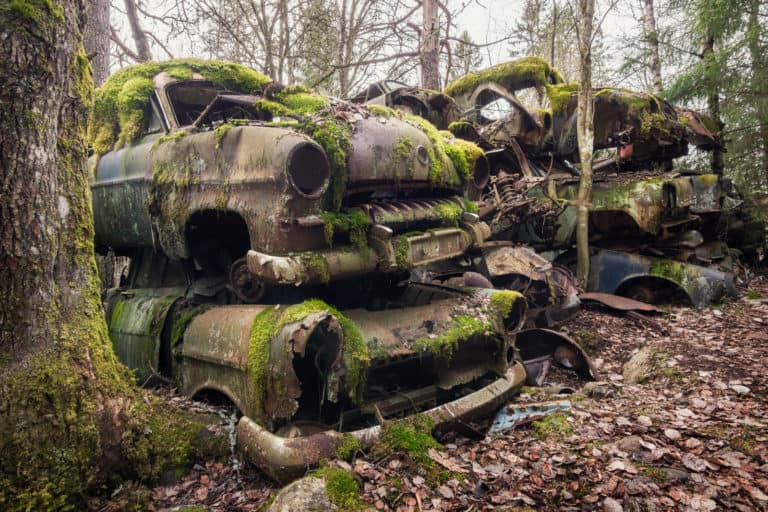 Car Cemetery In The Forest Sweden Featured Image