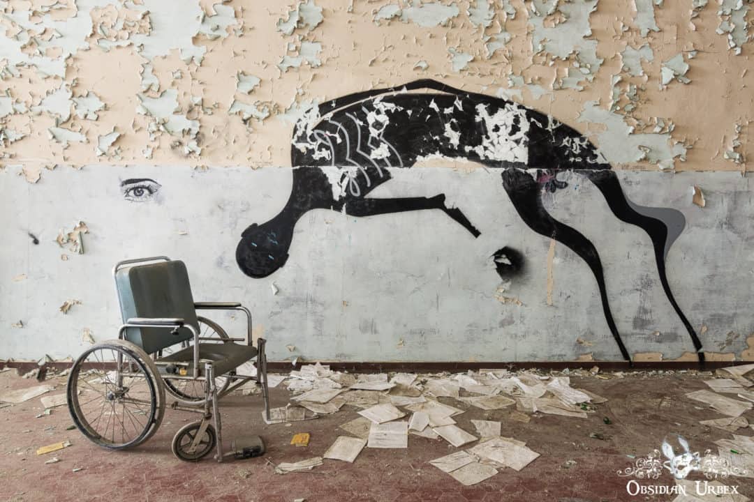 Manicomio di C Italy Black Ghost Graffiti on Abandoned Hospital Wall