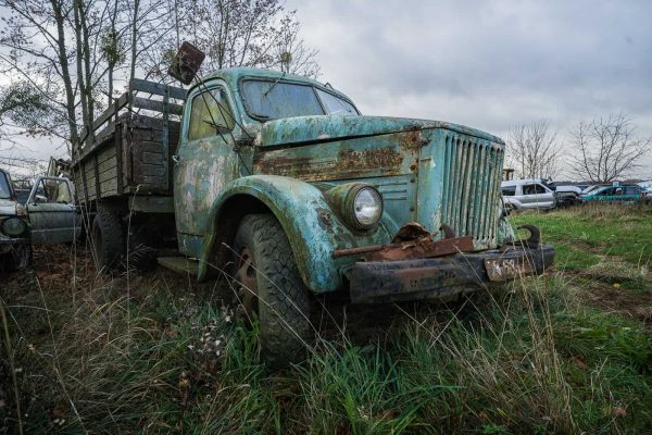 Soviet Vehicle Graveyard Lithuania Featured Image